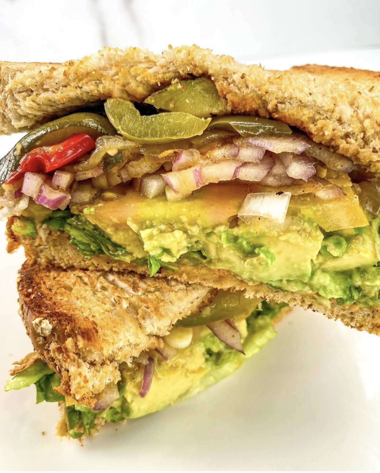 Sunshine's avocado sandwich with peppers, onions and fresh vegetables