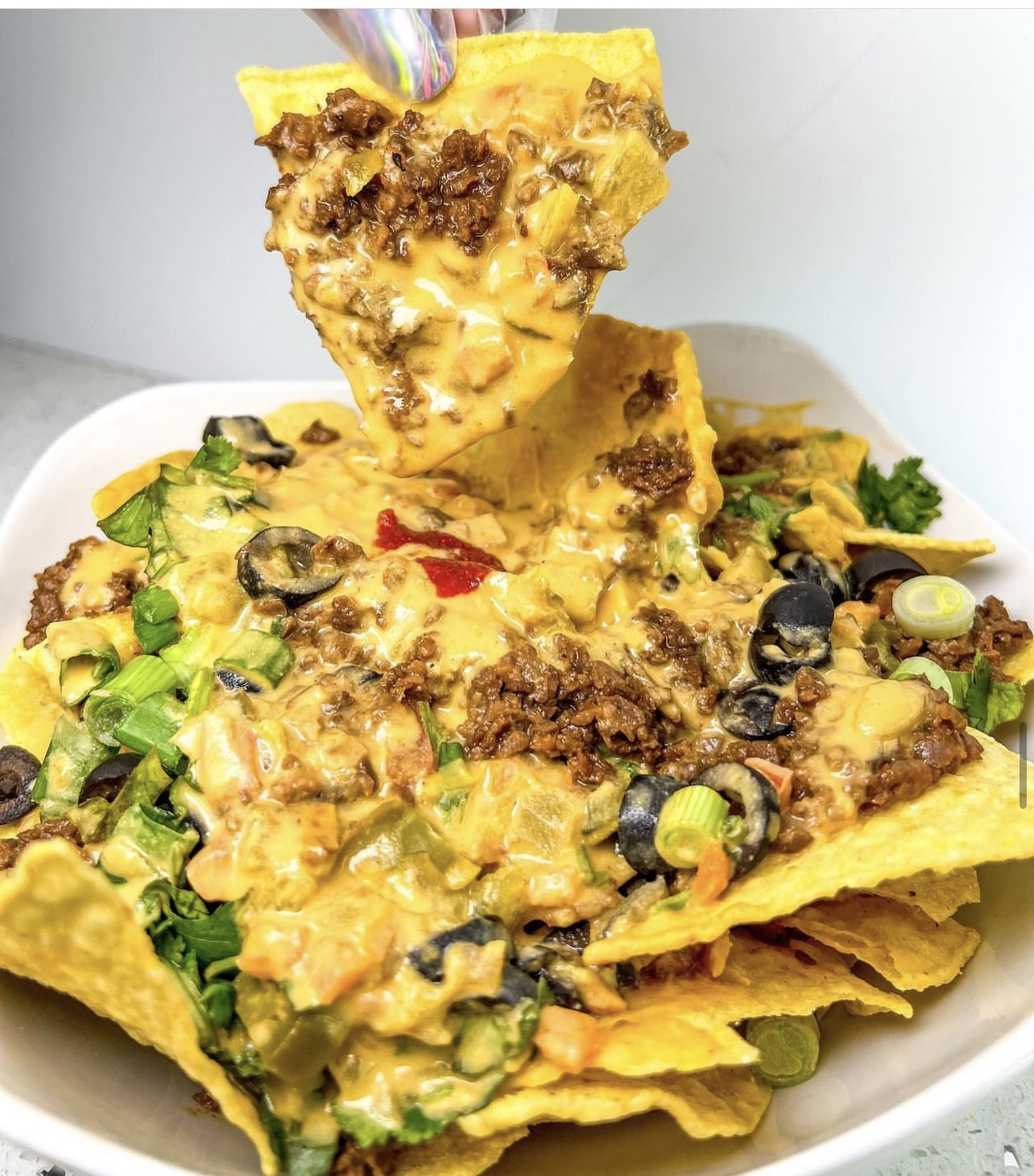 Sunshine's loaded vegetarian nachos with plant-based meat, cheese, olives and vegetables